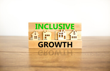 Inclusive growth symbol. Concept words Inclusive growth on beautiful wooden blocks. Beautiful wooden table white background. House model. Business inclusive growth concept. Copy space.