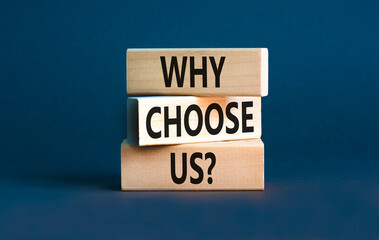 Why choose us symbol. Concept word Why choose us on beautiful wooden block. Beautiful grey table...