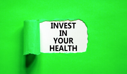 Invest in your health symbol. Concept word Invest in your health on beautiful white paper. Beautiful green paper background. Invest in your health concept. Copy space.