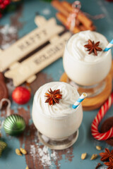 Obraz na płótnie Canvas Christmas Tom and Jerry cocktail or eggnog with whipped cream in glasses on decorated background