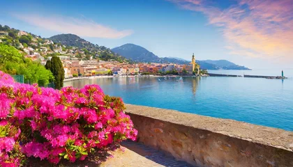 Fototapeten seafront landscape with azalea flowers french reviera view of stunning picturesque coastal town © Ernest