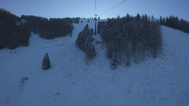 SLOW MOTION SHOT - View from inside the cabine Zwolferhorn cable car. Cable car or telecabin in Sankt St. Gilgen village, starting from the town and up to Das Zwolfer station, Austria.