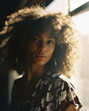 Confident young african american woman with curly hair in a casual fashion portrait