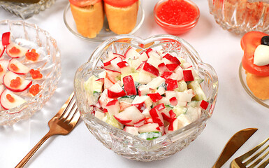 Christmas New Year dishes, detox diet concept, traditional holiday vegetable salad of cucumbers, tomatoes and radishes, healthy lifestyle and healthy eating concept,