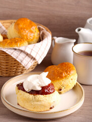 Classical scones with jam and whipped cream