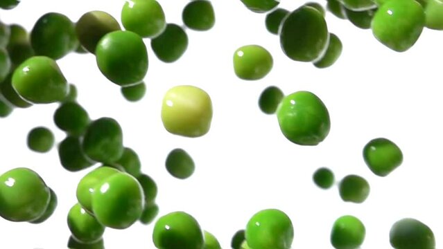 Super close-up of the green peas falling down on the white background