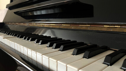 Close up view of a keyboard of a old piano	