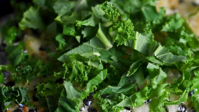 Kale leaves in a pan with onions, healthy food
