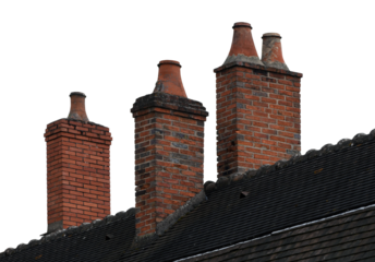 Old brick chimneys on the roof isolated on the blue background