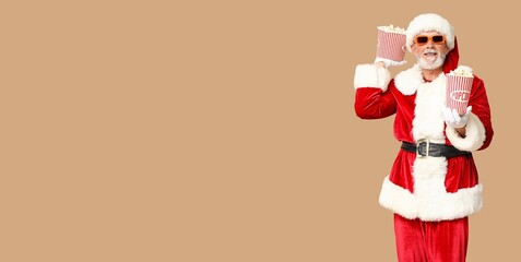 Santa Claus with 3d glasses and popcorn on beige background with space for text