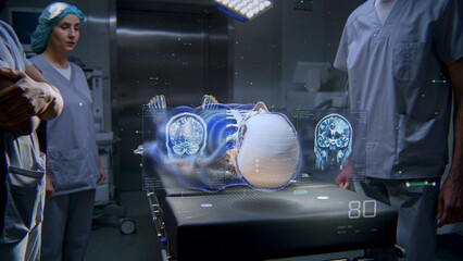 Diverse medical professionals work in operating room using holographic display. 3D rendering of virtual human skeleton and organs. VFX animation. AI technologies in medicine. Healthcare innovation.