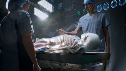 Male and female surgeons in AR headsets work in operating room using futuristic holographic...