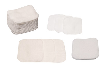 Stack of white cotton sponges isolated on a white background.