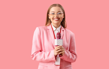 Female journalist with microphone on pink background