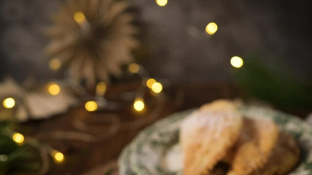 A crescent-shaped pastry whose filling is made of eggs and almonds wrapped in crispy dough, cut in an artisanal way and sprinkled with sugar.