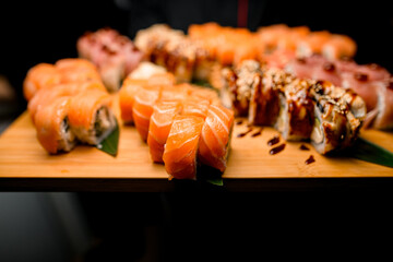 Rolling into Taste. Tuna, Sesame, Teriyaki Sushi on Leafy Canvas