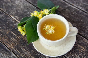 cup of herbal linden tea with honey and lemon. doctor treatment and prevention of immune concept,...