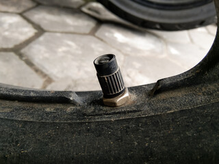 Close the hubcap on a motorbike.