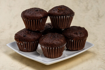 chocolate muffins with chocolate,Chocolate muffins stacked in a stack, tasty and fragrant