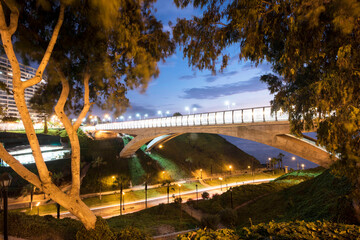 PERU Panoramic view of the Villena Rey Bridge of the Miraflores district with luxurious apartments and Pacific Ocean at night © Luis