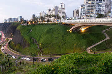 PERU Panoramic view of the Villena Rey Bridge of the Miraflores district with luxurious apartments and Pacific Ocean at night © Luis
