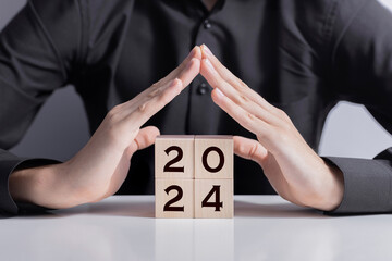 2024 New year. New home, Real estate,  House Mortgage, Real Estate tax  and  insurance. Wooden...
