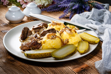 Fried liver with onion.