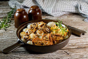 Stewed pork chop in a bright mushroom sauce.
