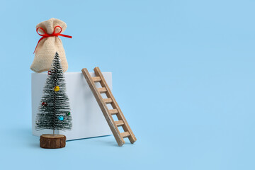 Decorative podium with Christmas decorations on blue background