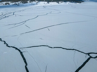 Aerial winter view of Batak Reservoir covered with ice, Bulgaria