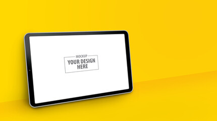 Horizontal tablet computer mockup with perspective view on yellow background. Blank tablet pc screen includes clipping path for easy editing.