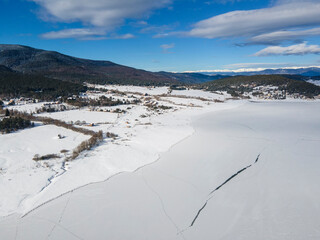 Aerial winter view of Batak Reservoir covered with ice, Bulgaria