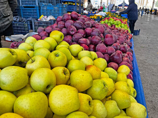 Yellow and red apples at the farmers' market.