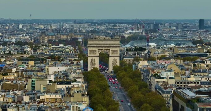 France, Paris Arc de Triomphe in Champs Elysees at sunset. Aerial view 