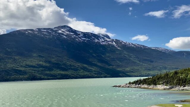 Skagway, Alaska: Thranda Cessna c208 Caravan operated by Alaska Seaplanes. Yakutania Point and rocky shoreline and outlet of Skagway river.