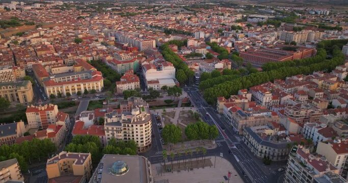 Establishing shot of french city of Perpignan is located on the seashore. Aerial view of the central area of a tourist city in summer. Drone view of the southern city of France. Center of city