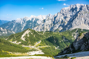 Vrsic Pass and Prisojnik, or Prisank, Mountain. Sunny day in Julian Alps, Slovenia - obrazy, fototapety, plakaty
