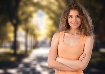 Portrait of cheerful young woman in the autumn park