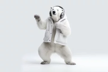 Foto op Canvas Polar bear in headphones listening music and making dance moves on white background © gankevstock