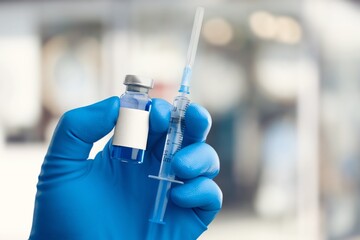 Professional doctor hold injection for treatment.