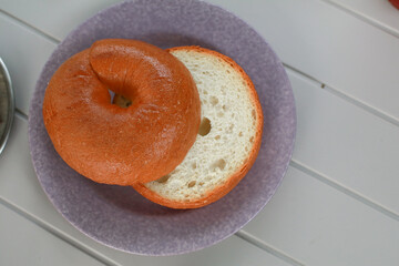Homemade freshly baked Bagel on table. Healthy bagel sandwich Delicious breakfast. Take away fast...