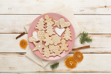 Cute homemade Christmas cookies with decor on color background,top view