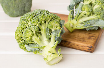 Fresh tasty broccoli on wooden table