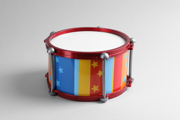 Colorful drum on light background. Percussion musical instrument