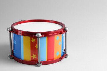 Colorful drum on light background. Percussion musical instrument