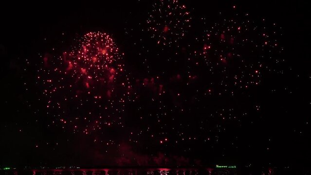 Real fireworks background. Firework Display, abstract blur of real golden shining fireworks lights at night sky. glowing fireworks show. Firework Explosive Material. New year's eve fireworks	
