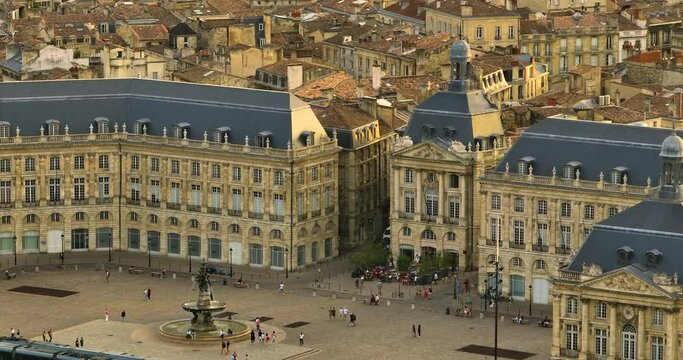 Traffic, Establishing aerial view shot of Bordeaux, world capital of wine, France. A beautiful city on the banks of the river. View from a drone of the city center. Rooftops of houses filmed by drone