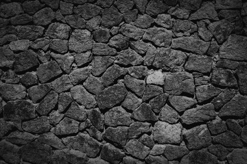A wall made of piled stones, with rough stone texture and texture, graphic design, excellent image...