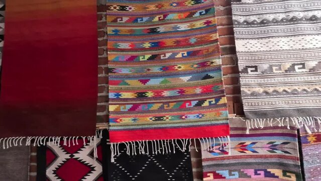 Mexican rugs made of sheep wool on the floor of a traditional workshop, oaxaca handcraft