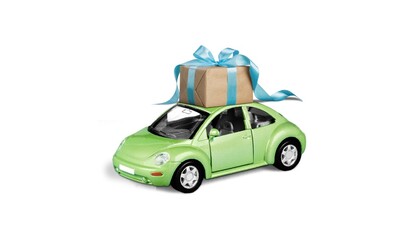 Retro toy car with gift box with bow